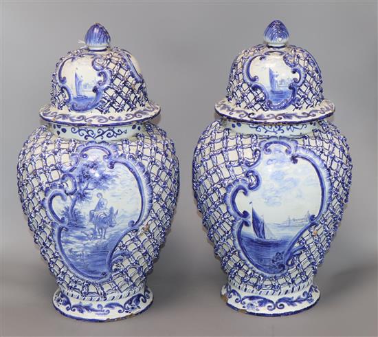 A pair of large 19th century Delft blue and white vases and covers height 40cm